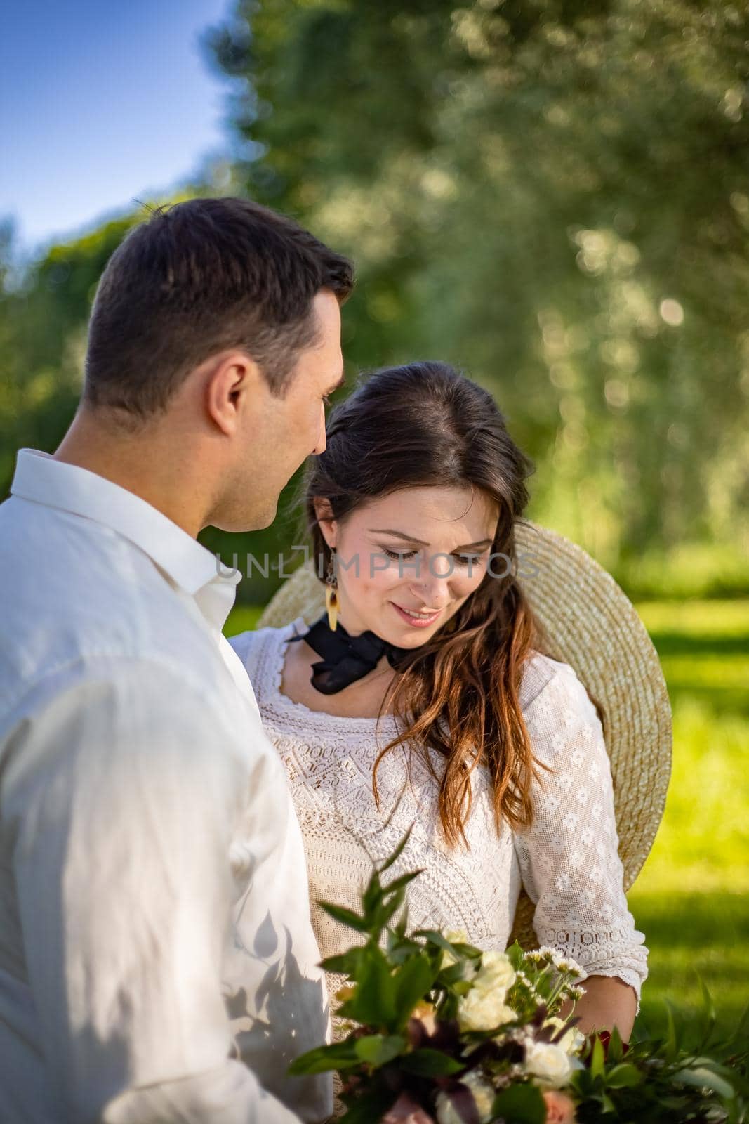 nice portrait of beautiful and young groom and bride outdoors