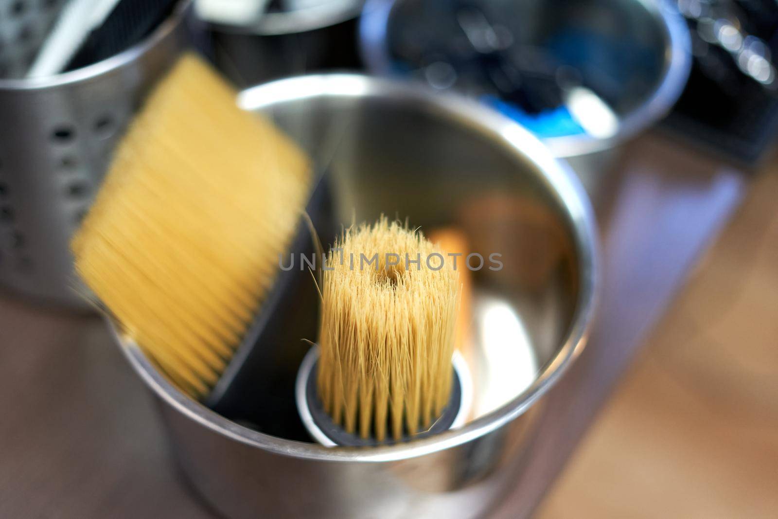 Top view of two barber brushes in a stain pan in a barber shop by WesternExoticStockers