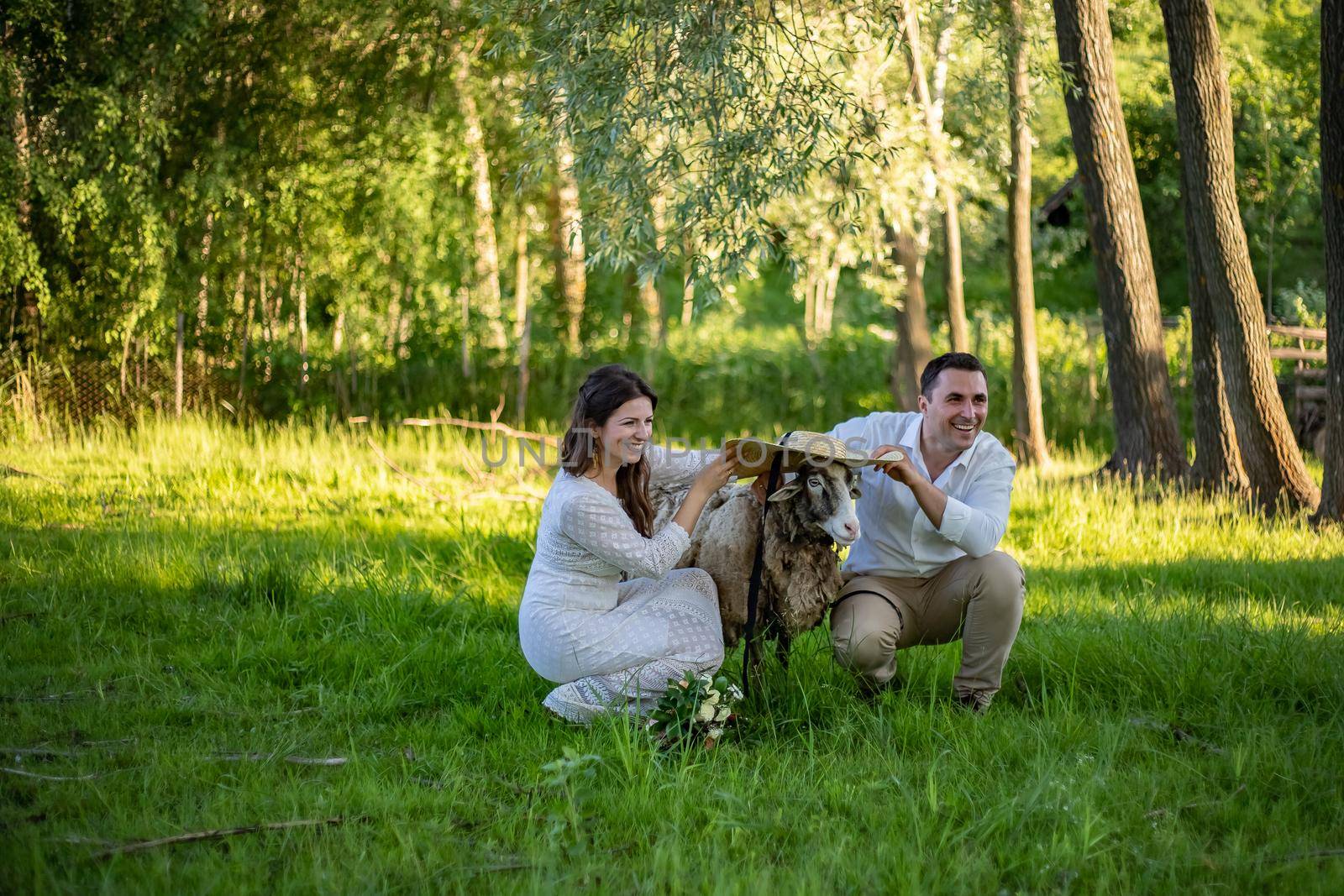 Beautiful wedding couple in nature in boho style. Wedding in the European style of fineart at sunset