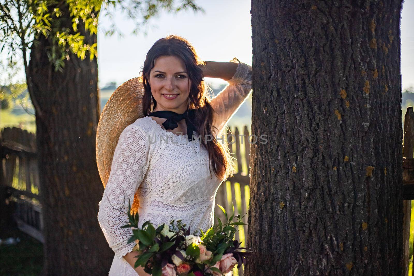 nice portrait of beautiful and young groom and bride outdoors