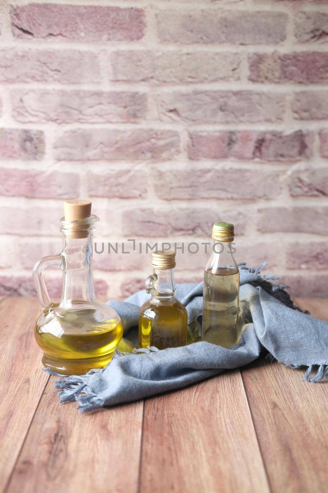 different bottle of olive oil on table ,