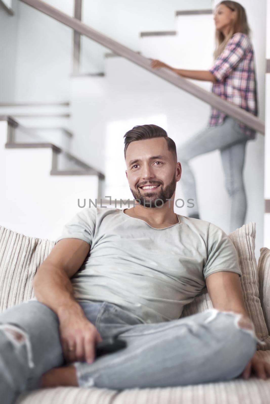 close up. young man sitting on sofa. photo with copy space