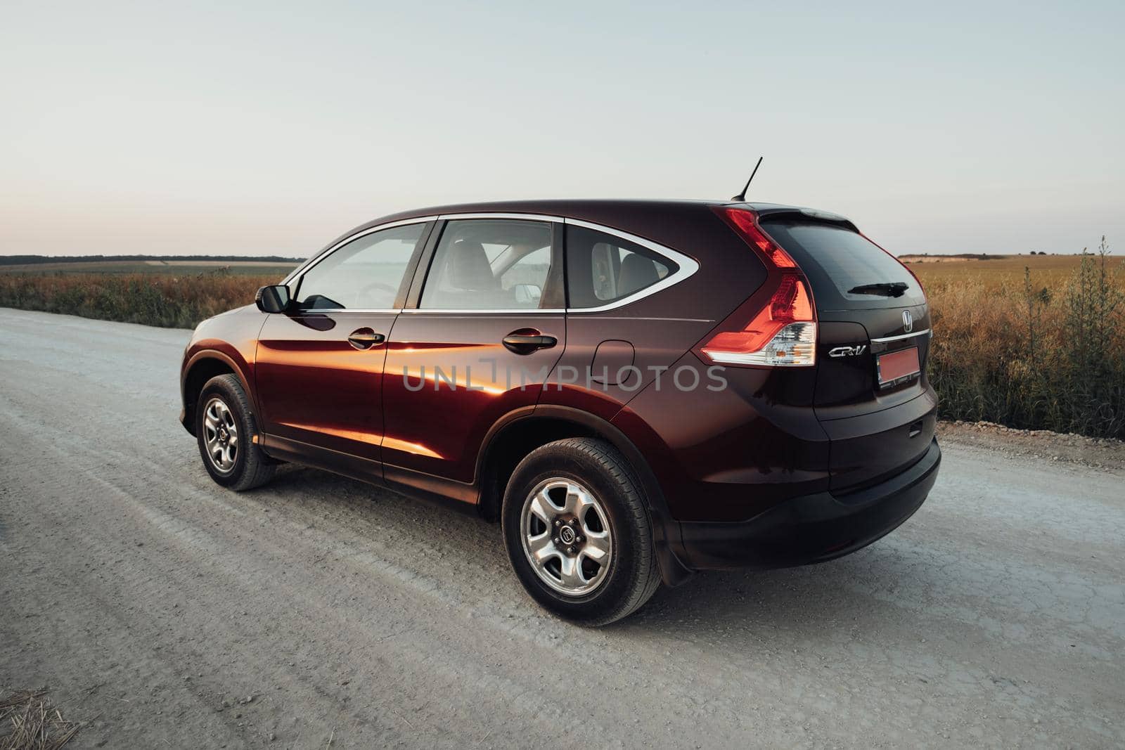 TERNOPIL, Ukraine - July 21 2021: Back View of Honda CR-V on Country Road