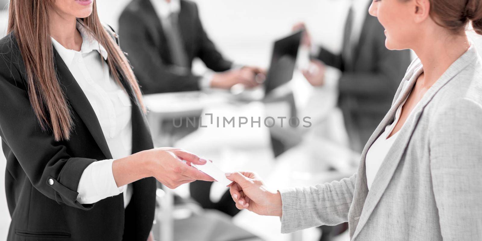 successful business woman gives her business card .business concept