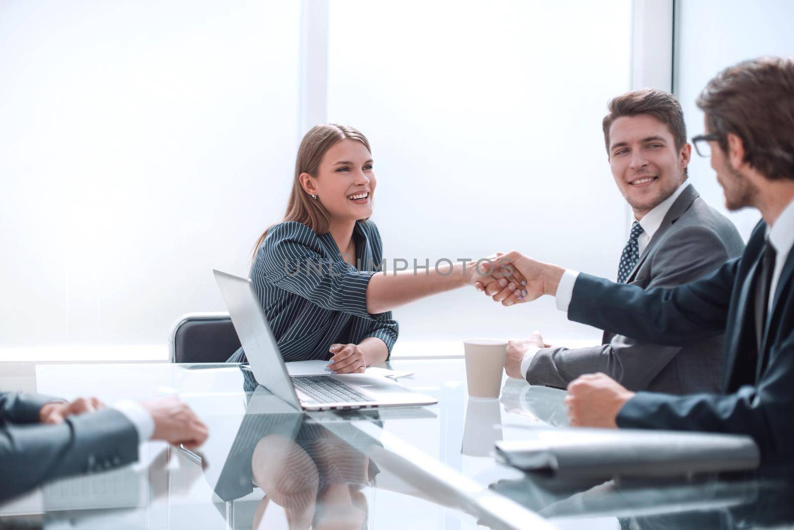 Business people shaking hands in the boardroom. concept of partnership