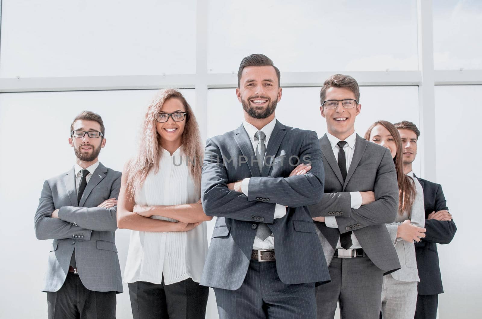 leader and business team standing in spacious office .photo with copy space