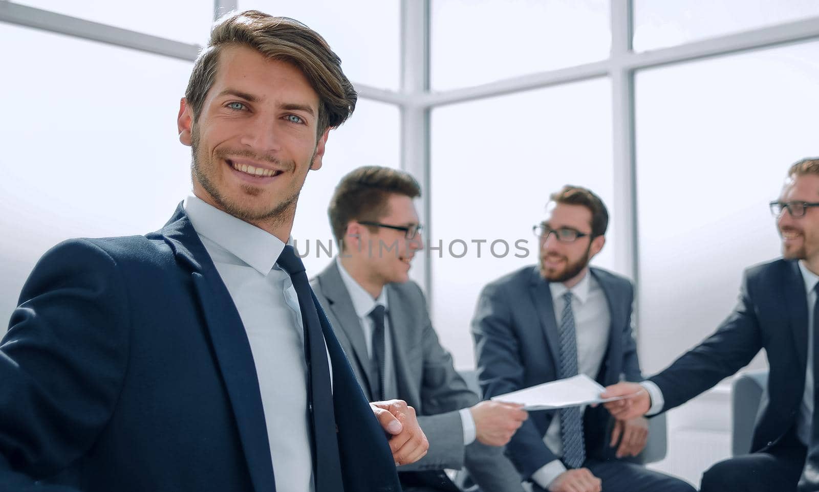 successful businessman on the background of the office.business concept