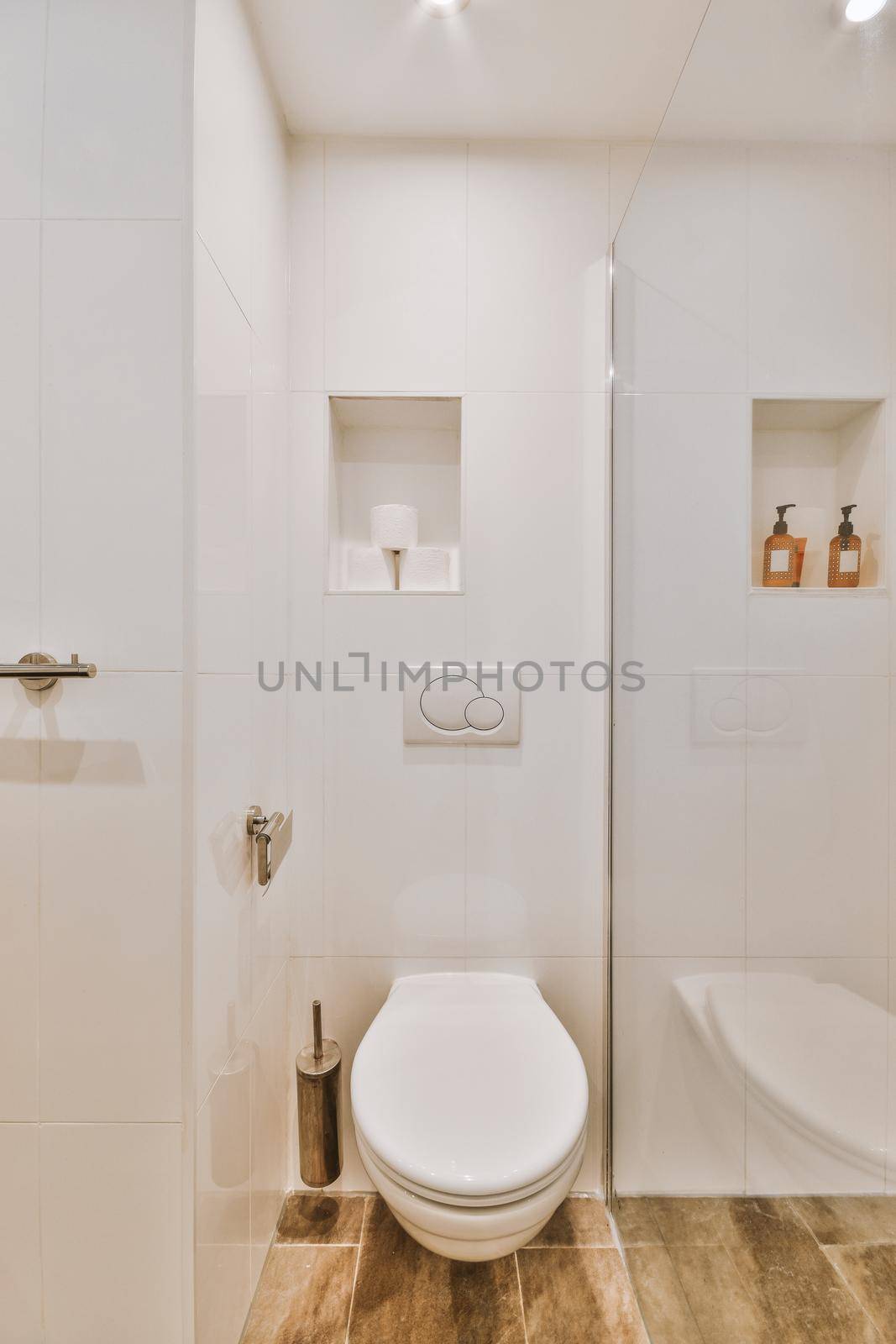 Small clean restroom by casamedia