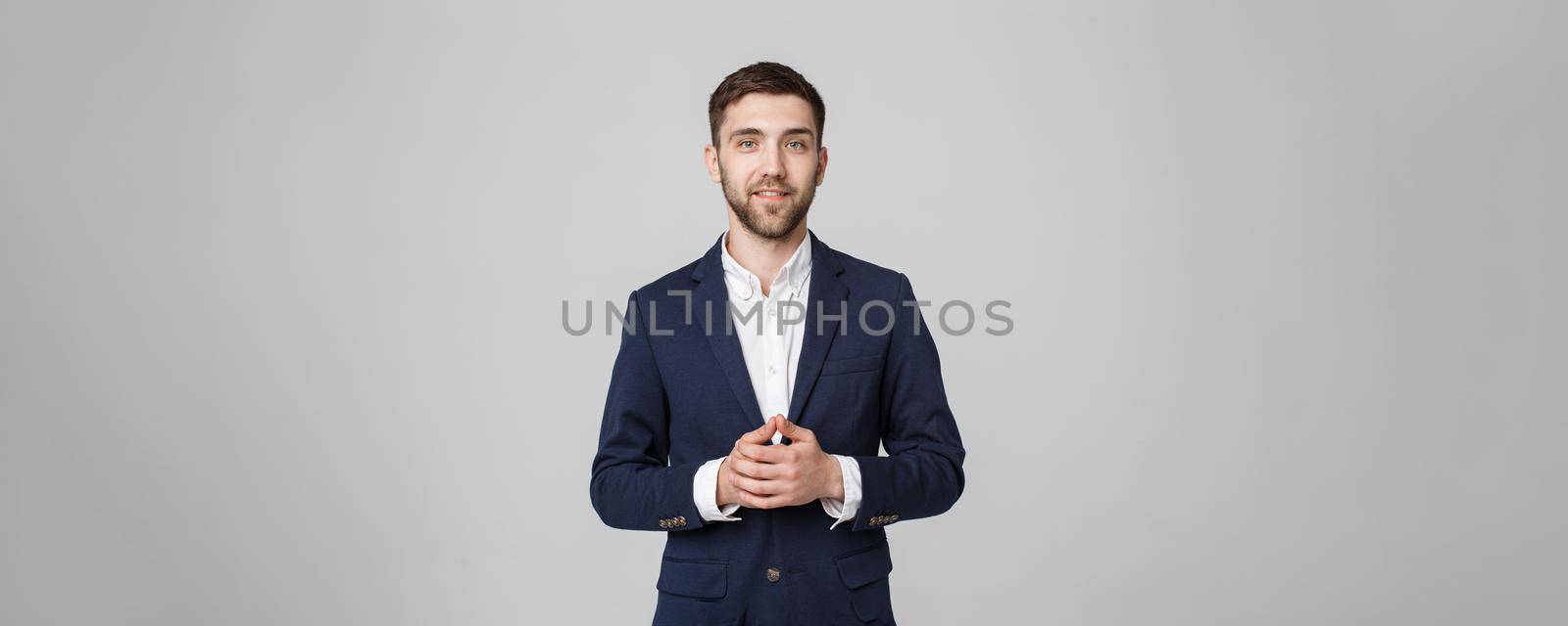 Business Concept - Portrait Handsome Business man holding hands with confident face. White Background. by Benzoix