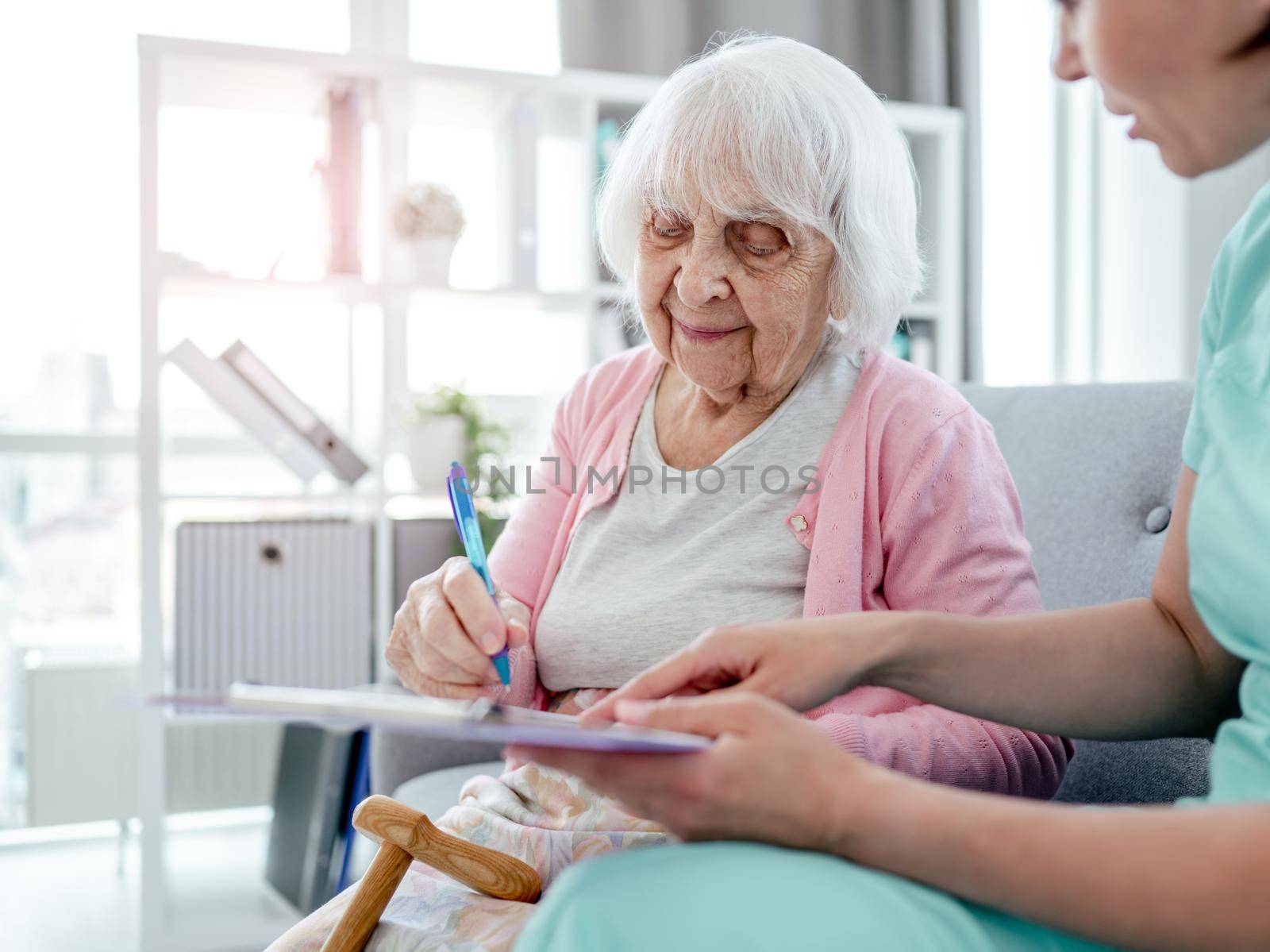 Elderly woman and nurse by tan4ikk1