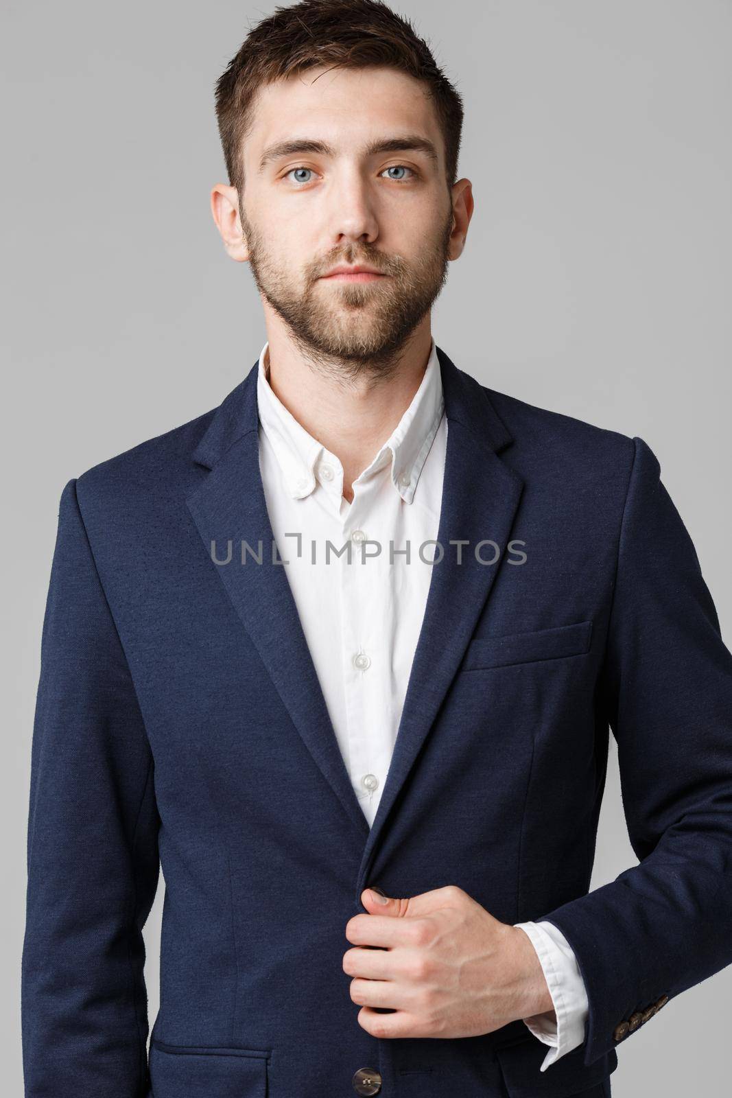 Business Concept - Young successful businessman posing over dark background. Isolated White Background. Copy space.