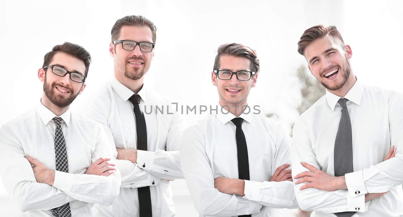 portrait of a successful business team standing near the desktop.the concept of teamwork