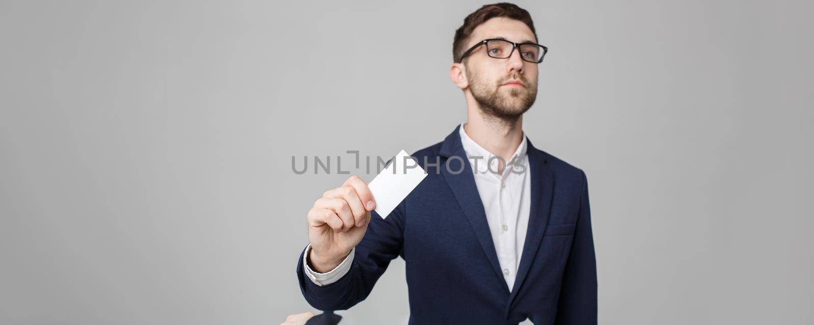Business Concept - Portrait Handsome Business man showing name card with smiling confident face. White Background.Copy Space.