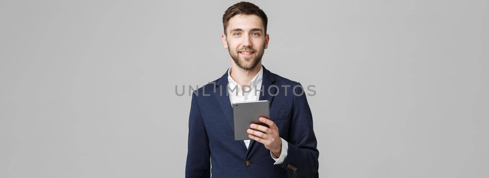 Business Concept - Portrait Handsome Business man playing digital tablet with smiling confident face. White Background. Copy Space.