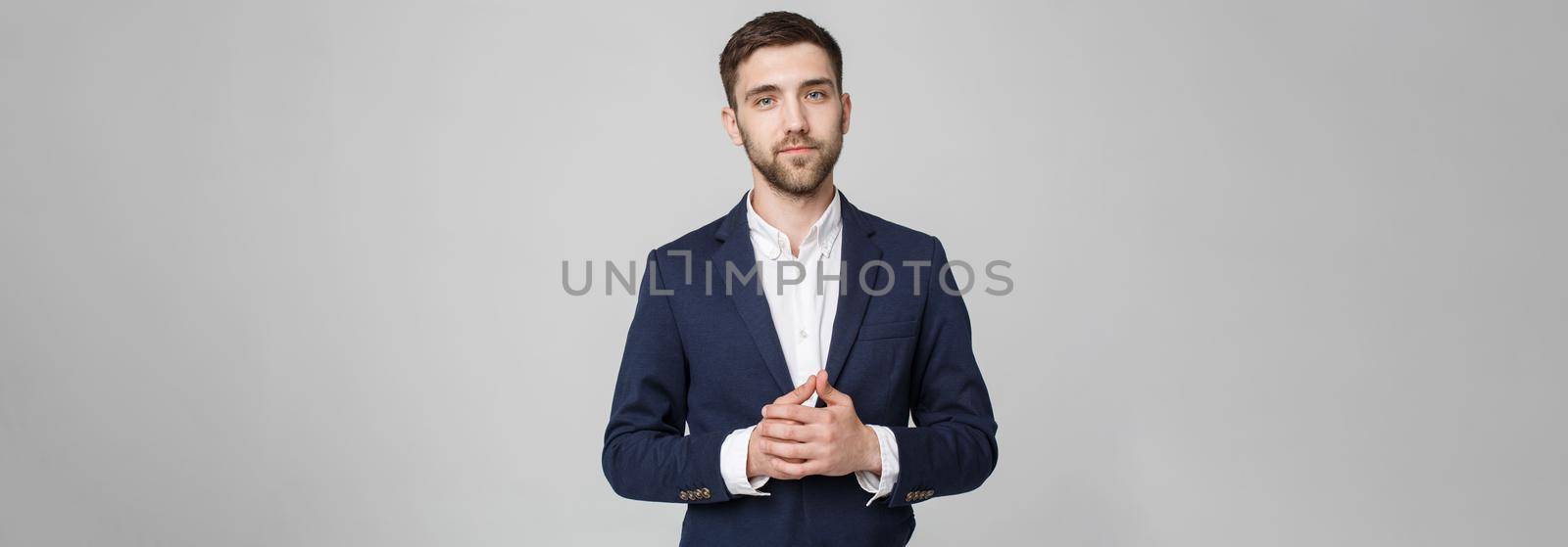 Business Concept - Portrait Handsome Business man holding hand with confident face. White Background. Copy Space. by Benzoix