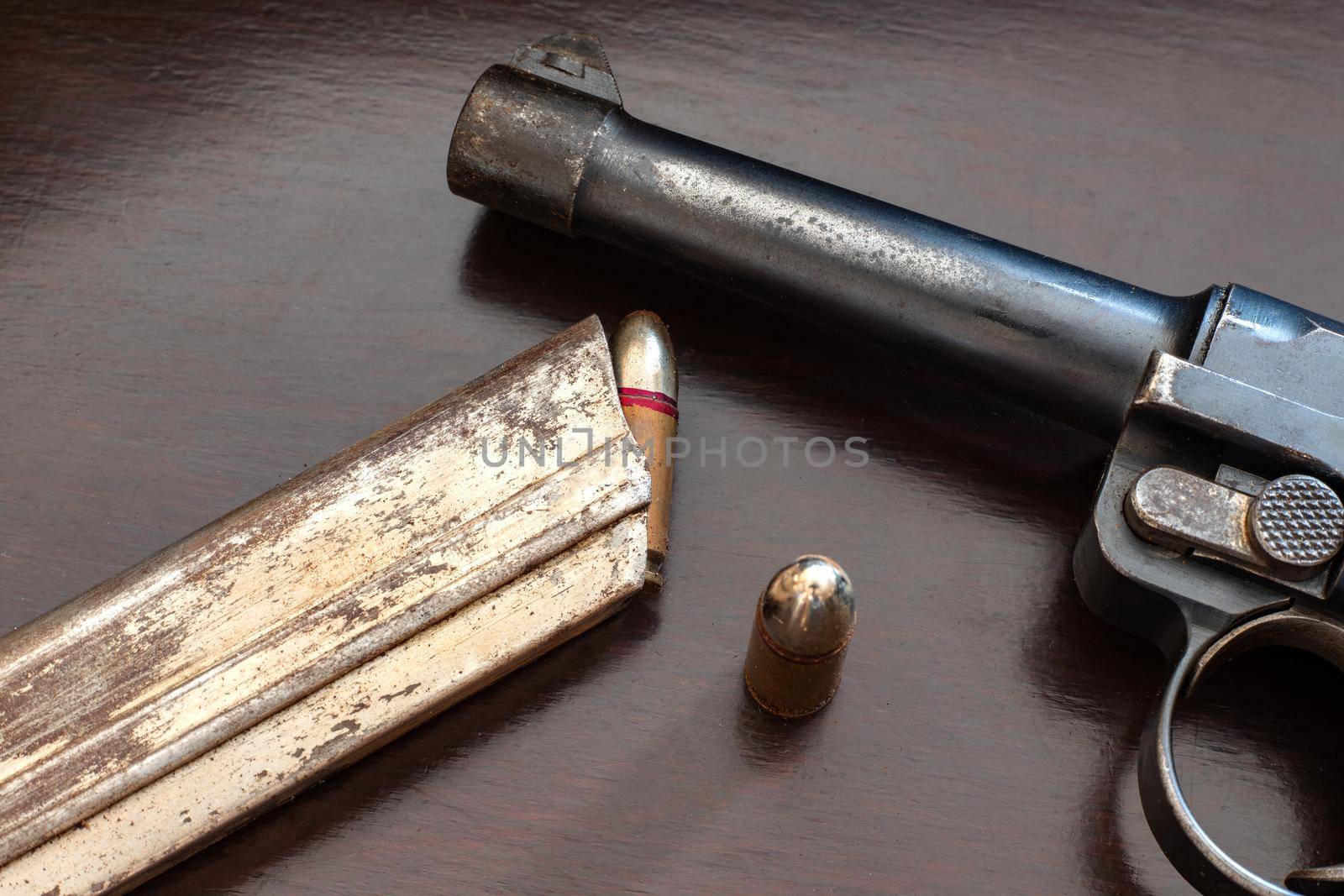 close-up of gunpoint and bullets on table. Weapons and ammunition. 