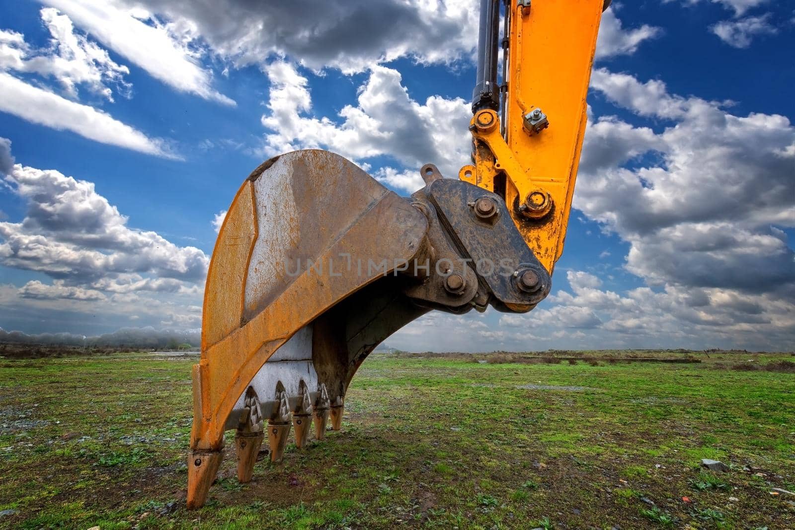 Industrial background. Digger bucket close-up. Construction excavator bucket.