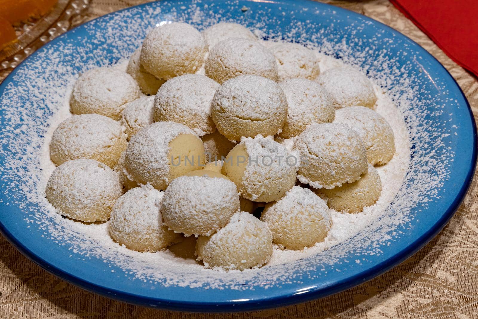 Homemade cookies with powdered sugar on a plate. Close up.