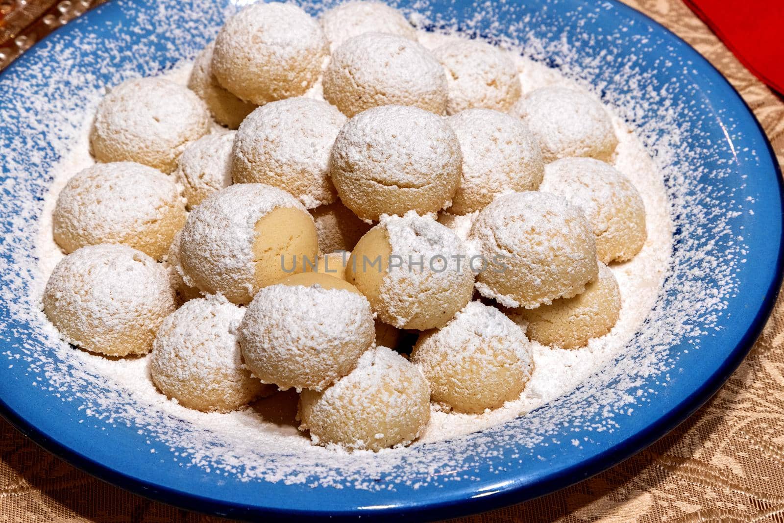 Homemade cookies with powdered sugar on a plate. Close up.