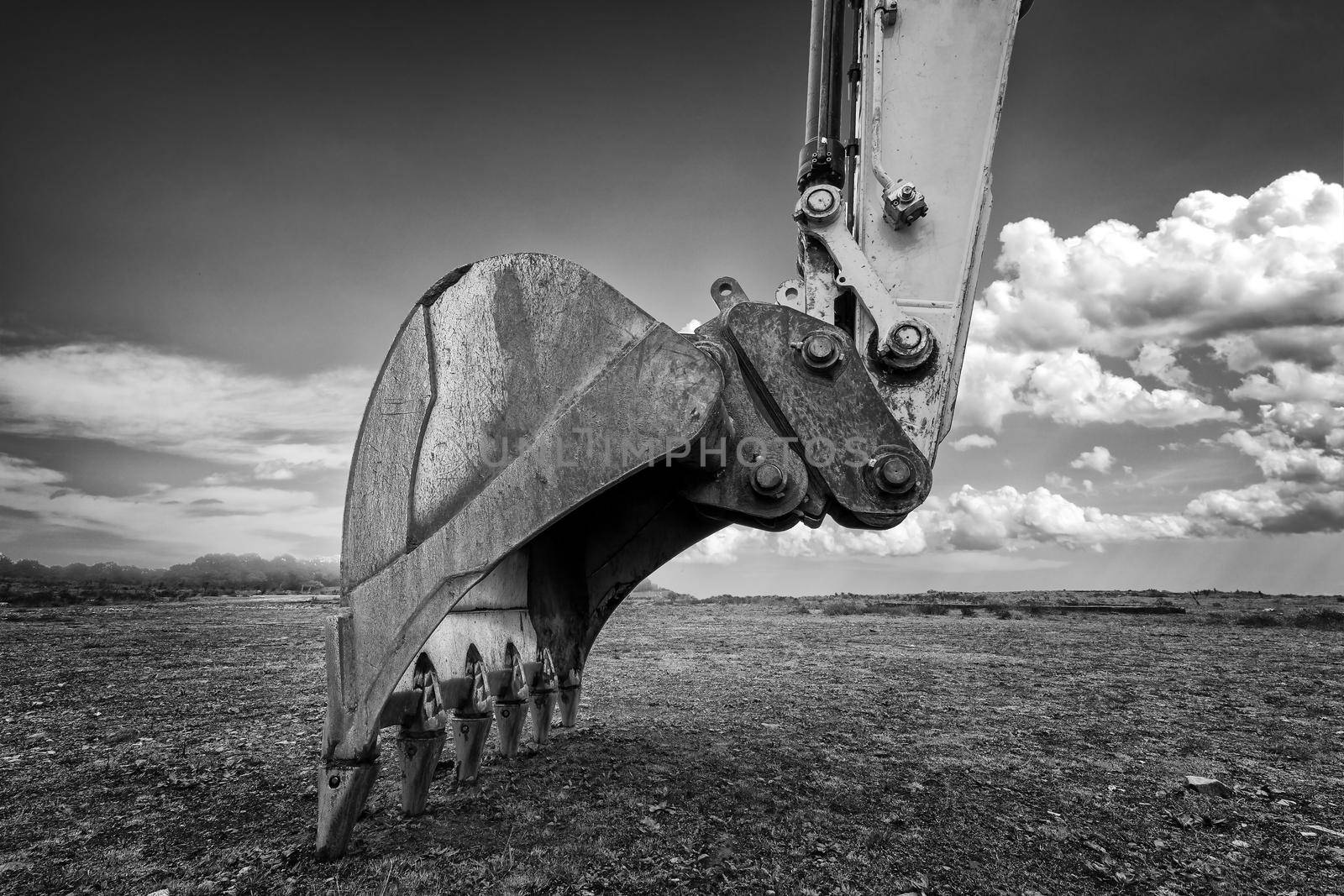 Industrial background. Digger bucket close-up. Construction excavator bucket.