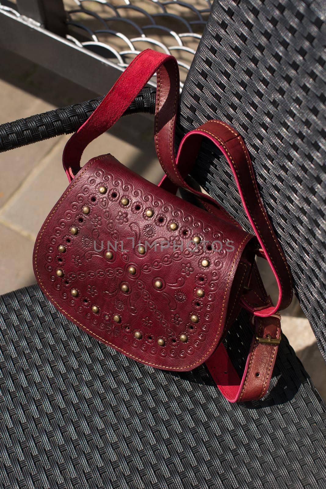 small burgundy women's leather bag with a carved pattern. by Ashtray25