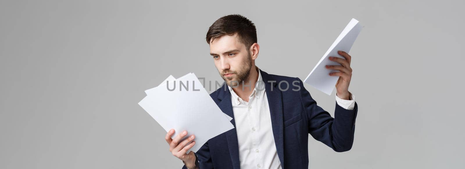 Business Concept - Portrait Handsome Business man serious working with annual report. isolated White Background. Copy space.