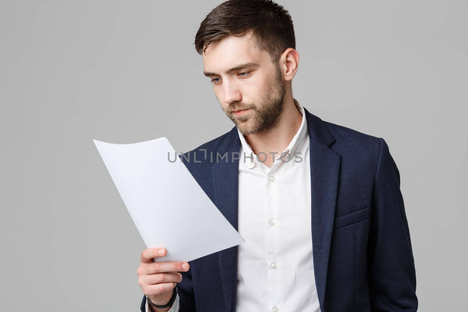 Business Concept - Portrait Handsome Business man serious working with annual report. White Background. Copy Space.