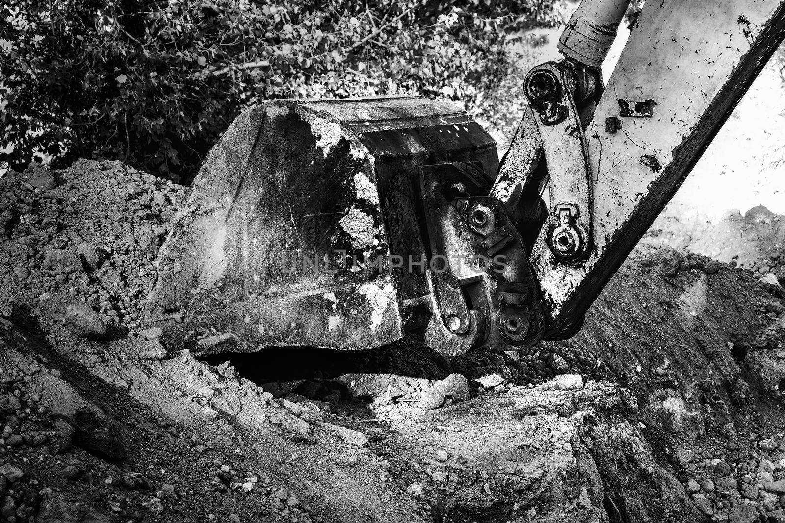 Industrial background. Digger bucket close-up. Construction excavator bucket.