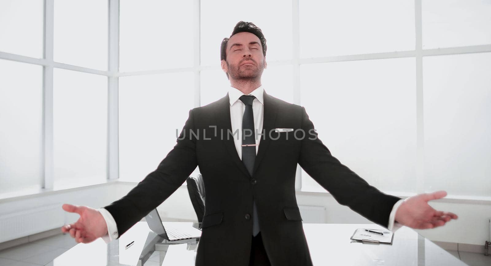dreaming businessman standing in his office.photo with copy space