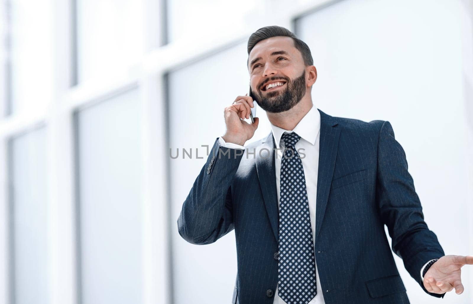 serious businessman talking on mobile phone.photo with copy space
