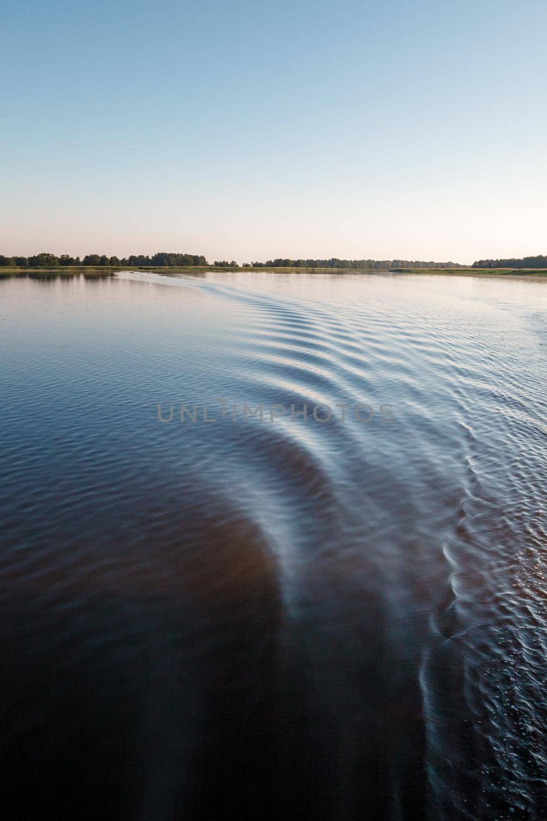 A very nice footprint of a ship's propeller in the lake water. by Lincikas