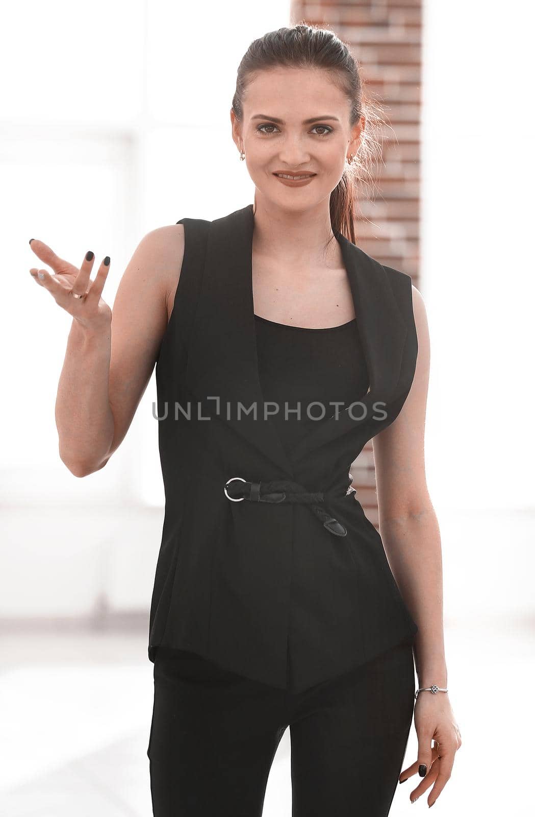 portrait of successful young business woman isolated on blurred background.