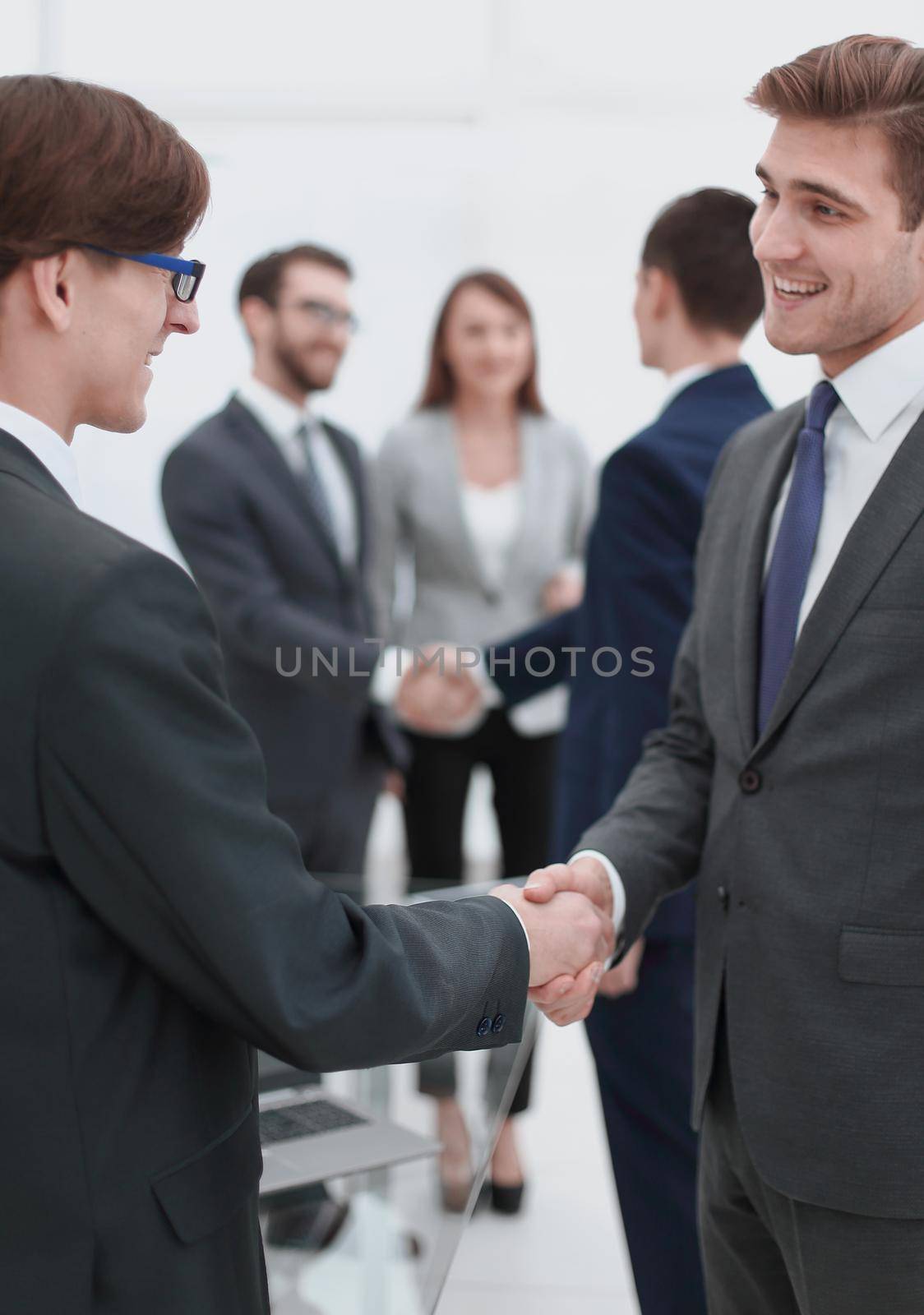 handshake of business partners after the briefing.