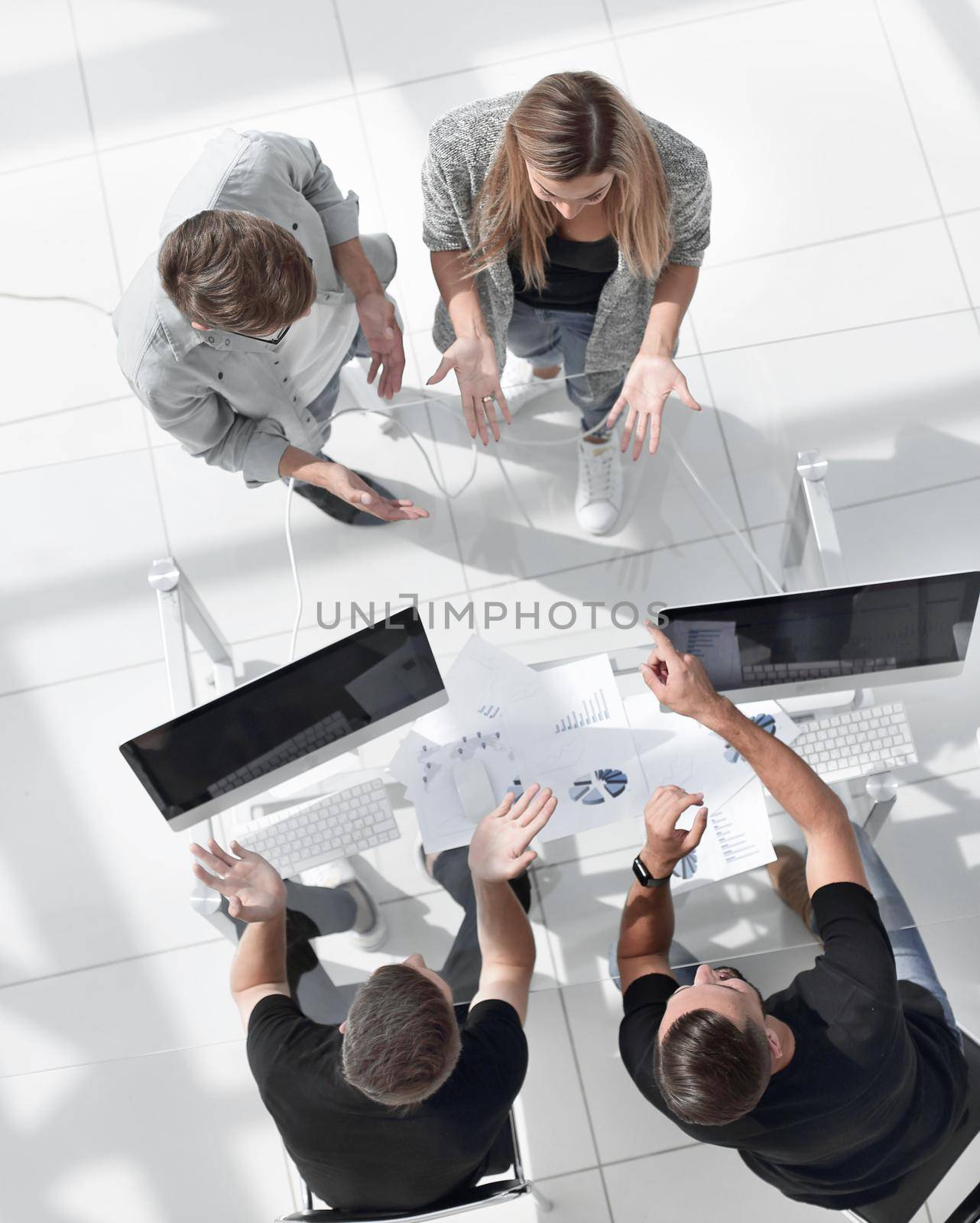 Business people sitting and discussing at business meeting, in office