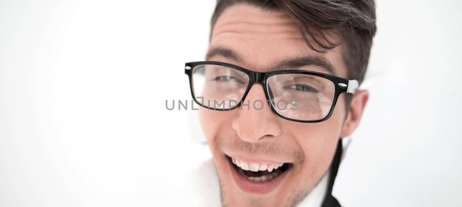 confident businessman breaking through a white paper wall.photo with copy space