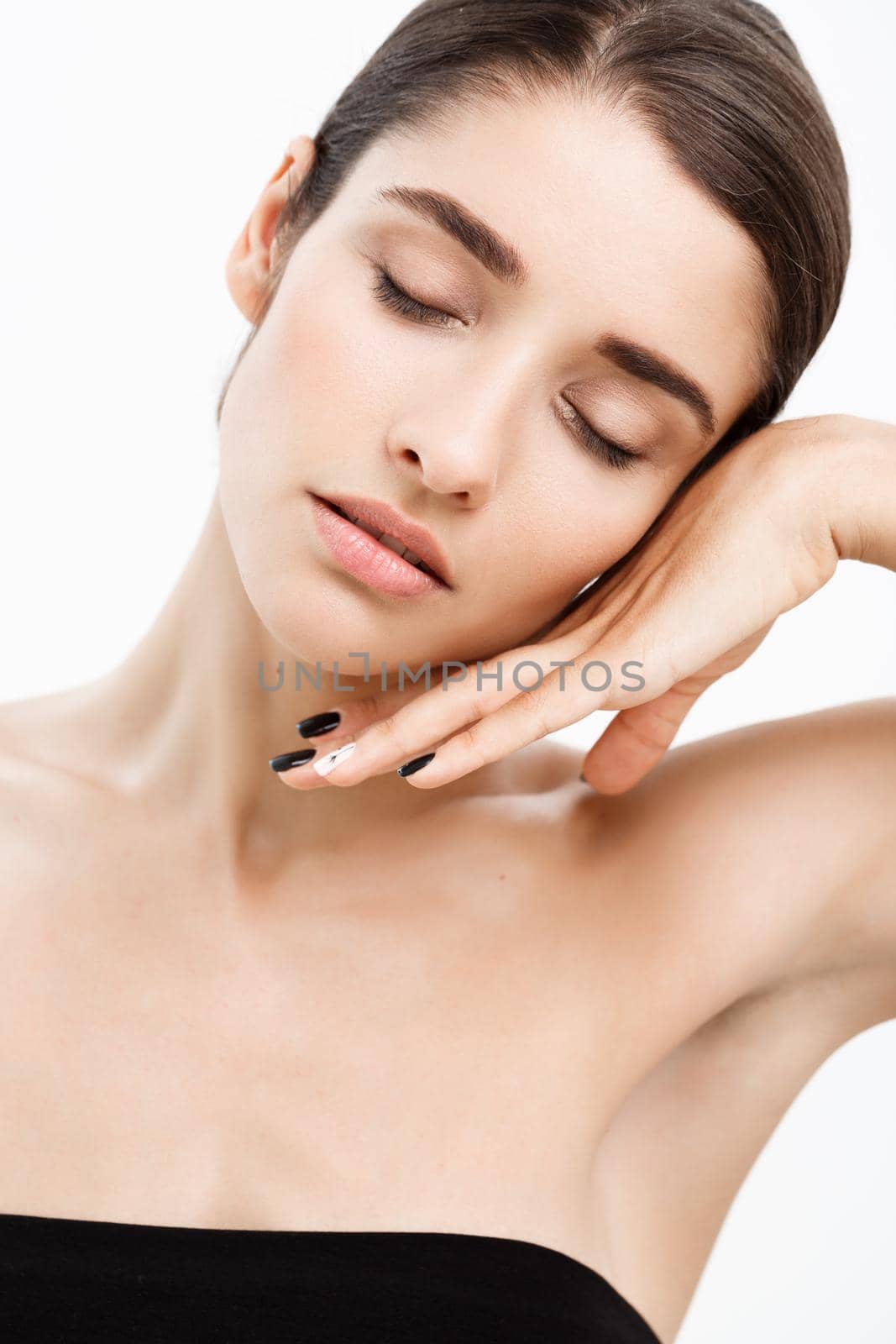 Beauty Youth Skin Care Concept - Close up Beautiful Caucasian Woman Face Portrait with relax sleep gesture. Beautiful Spa model Girl with Perfect Fresh Clean Skin over white background by Benzoix