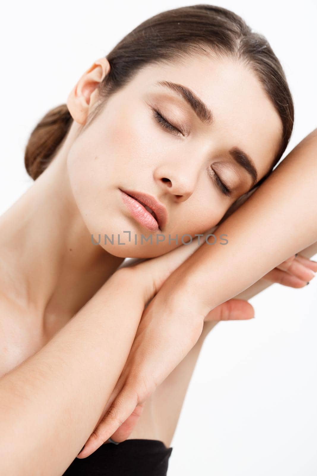 Beauty Youth Skin Care Concept - Close up Beautiful Caucasian Woman Face Portrait with relax sleep gesture. Beautiful Spa model Girl with Perfect Fresh Clean Skin over white background by Benzoix