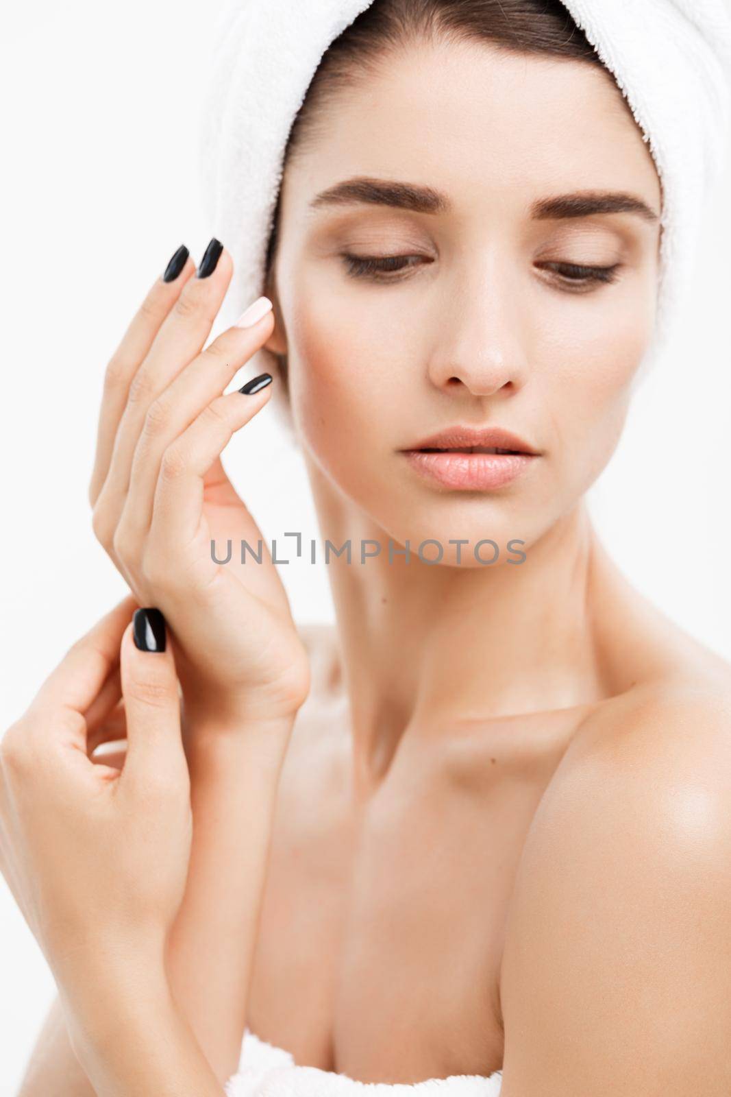 Beauty and Skin care concept - Close up Beautiful Young Woman touching her skin.