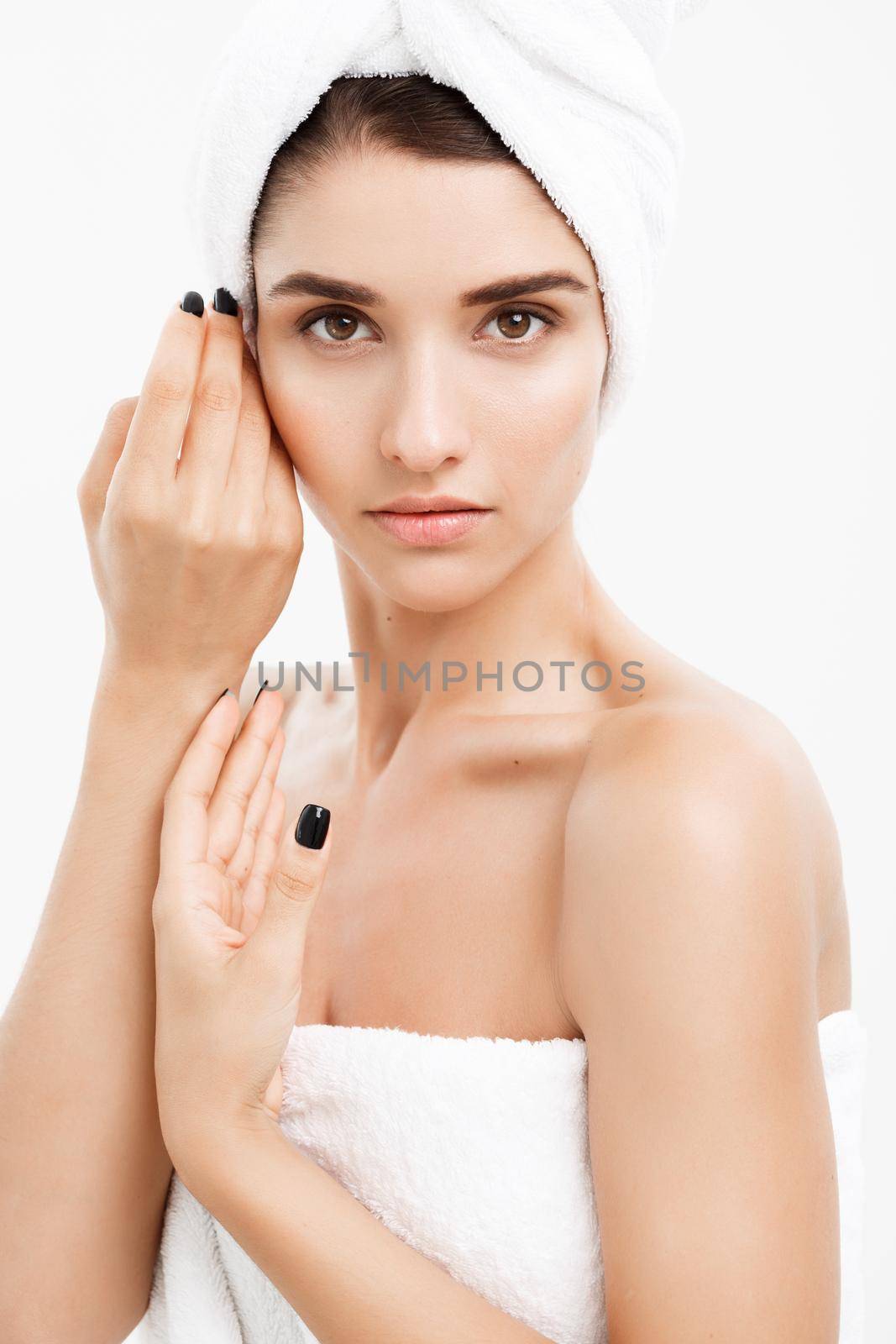 Beauty and Skin care concept - Close up Beautiful Young Woman touching her skin.