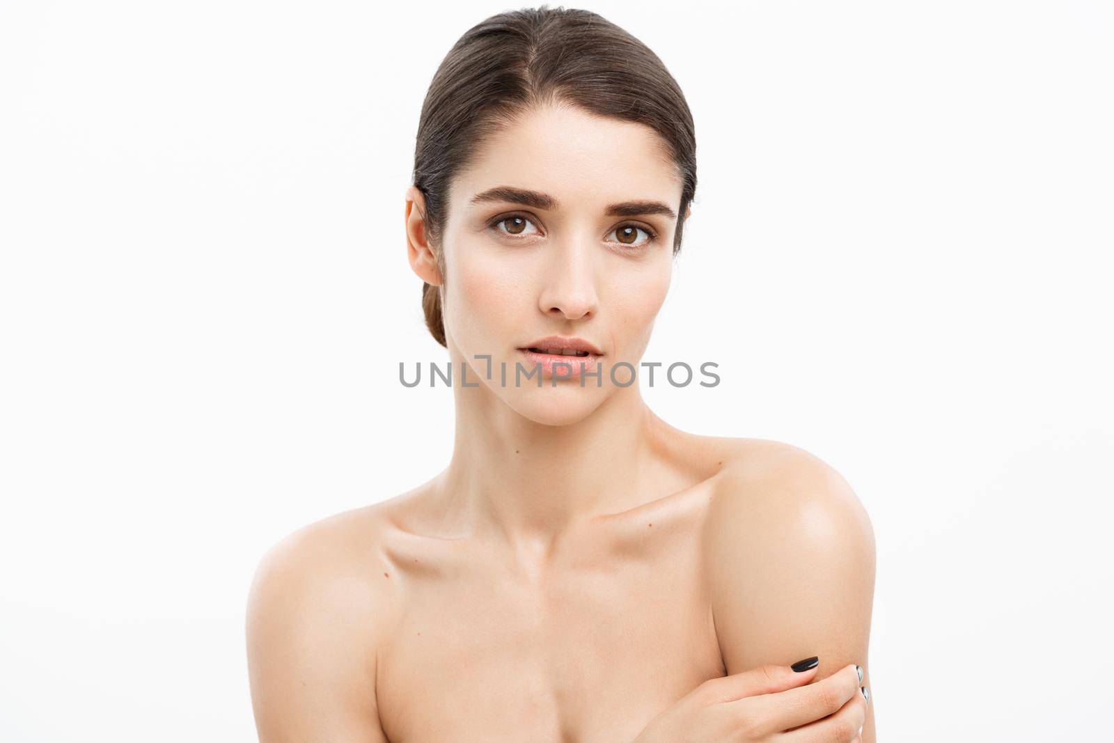 Beauty and spa concept - Charming young woman with perfect clear skin over white background. by Benzoix