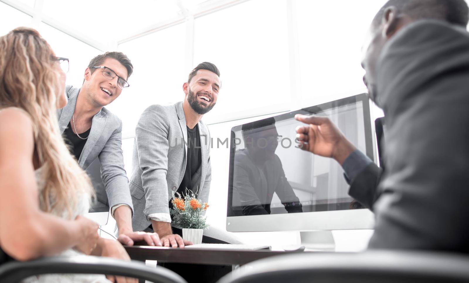 office staff talking in the workplace.the concept of teamwork