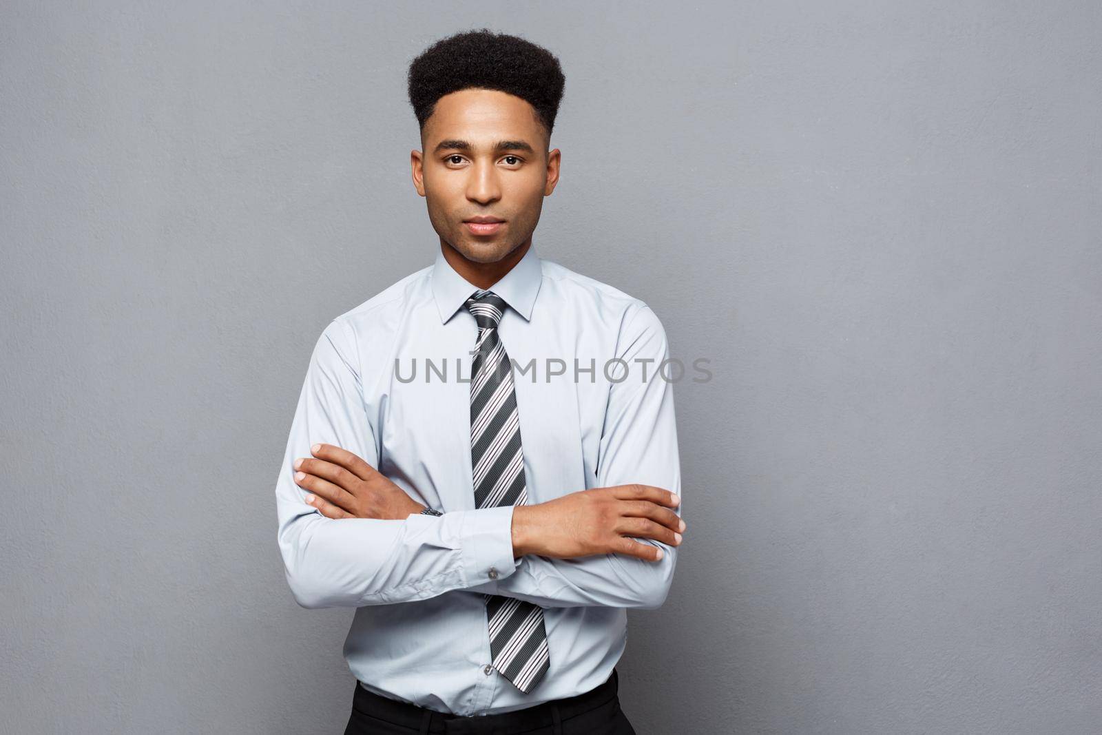 Business Concept - Happy professional african american businessman confident arms crossed