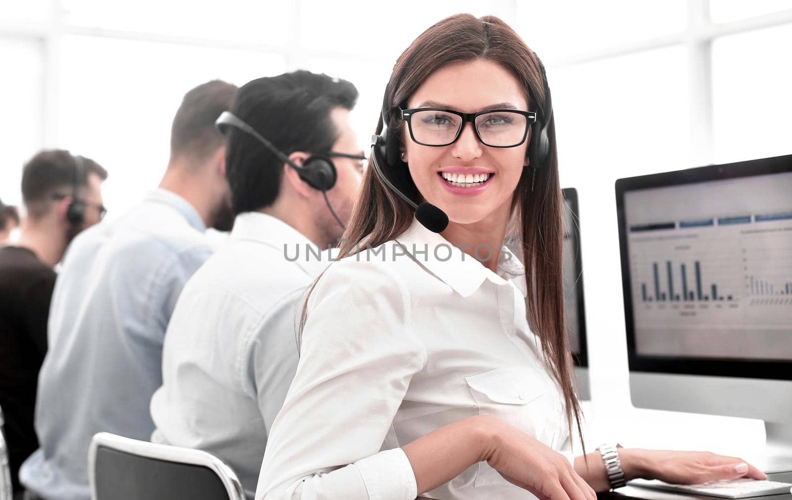 employee of the business center using the computers to analyze the data. photo with copy space