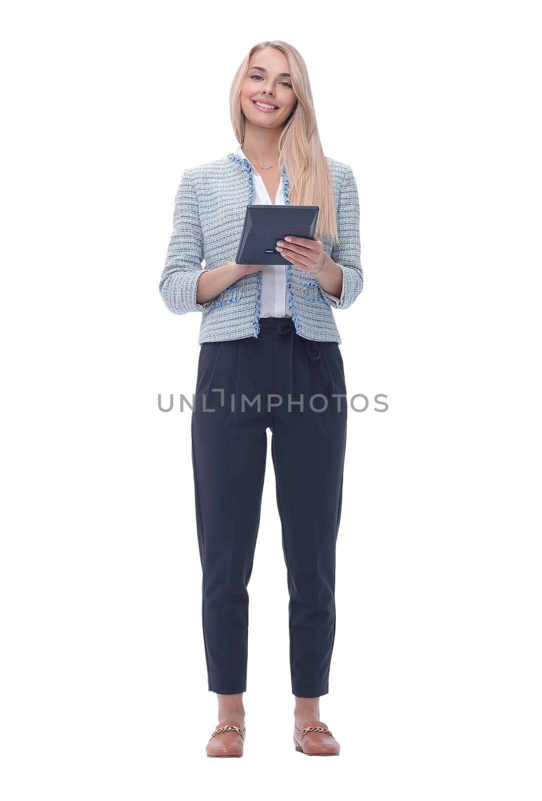 in full growth. smiling young business woman with calculator. isolated on white background