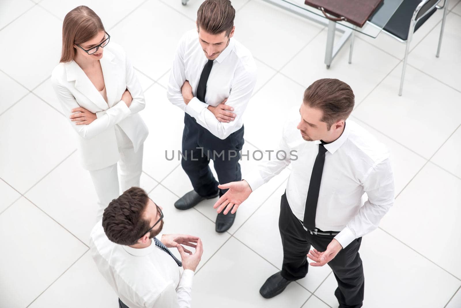 top view.a group of business people talking standing in the office.photo with copy space