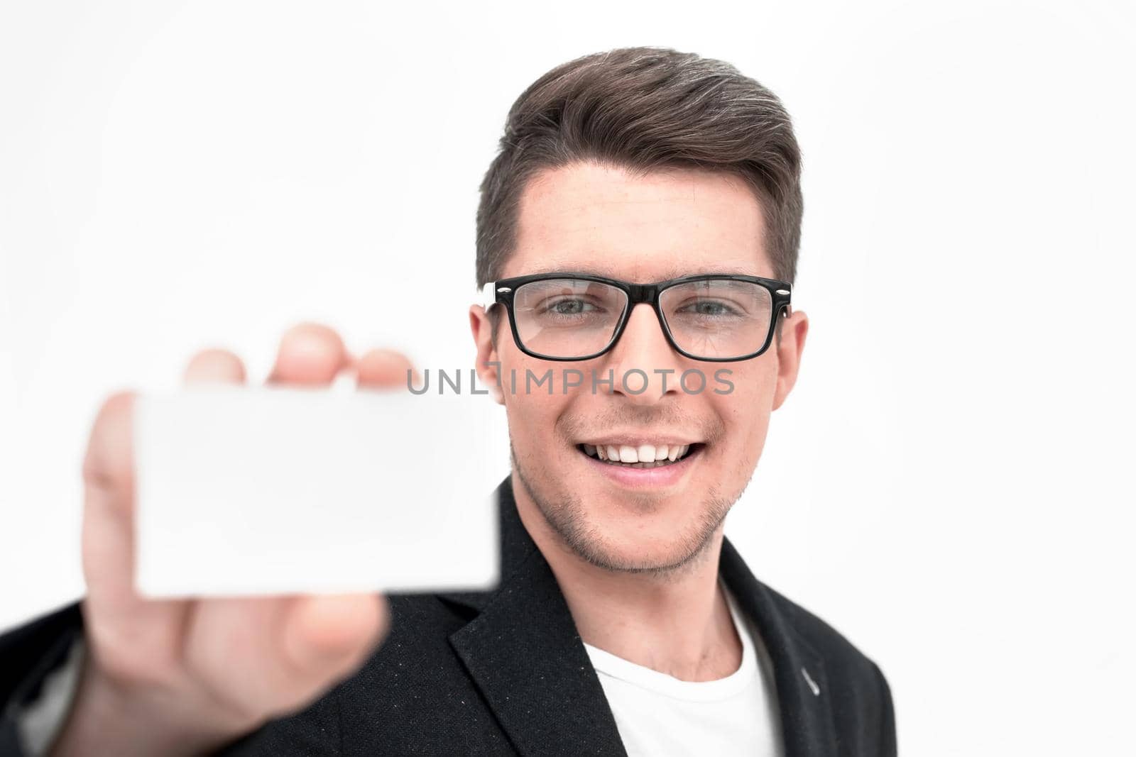 close up.young businessman showing his business card .photo with copy space