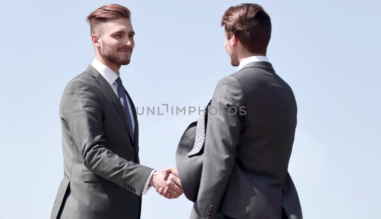 smiling business partners shaking hands.photo with copy space