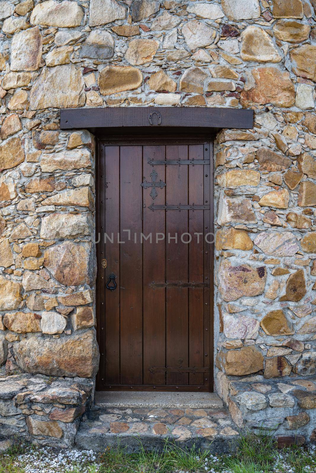 Old wooden door and stone wall by homydesign