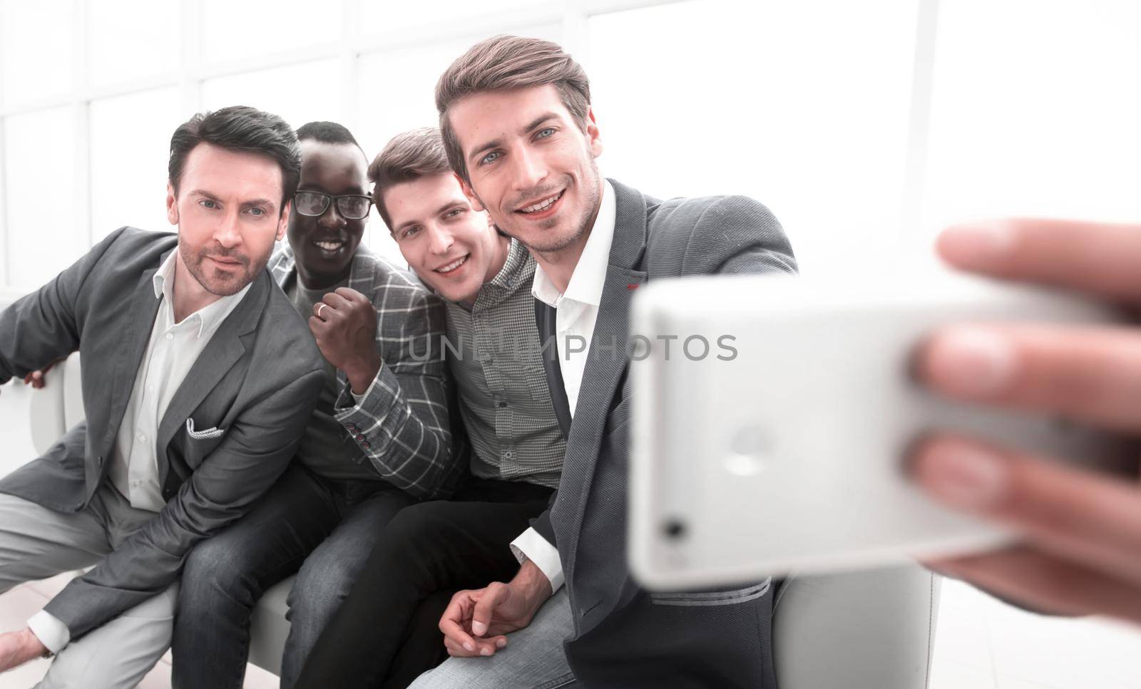 business colleagues take selfies in the office of the business center.photo on memory