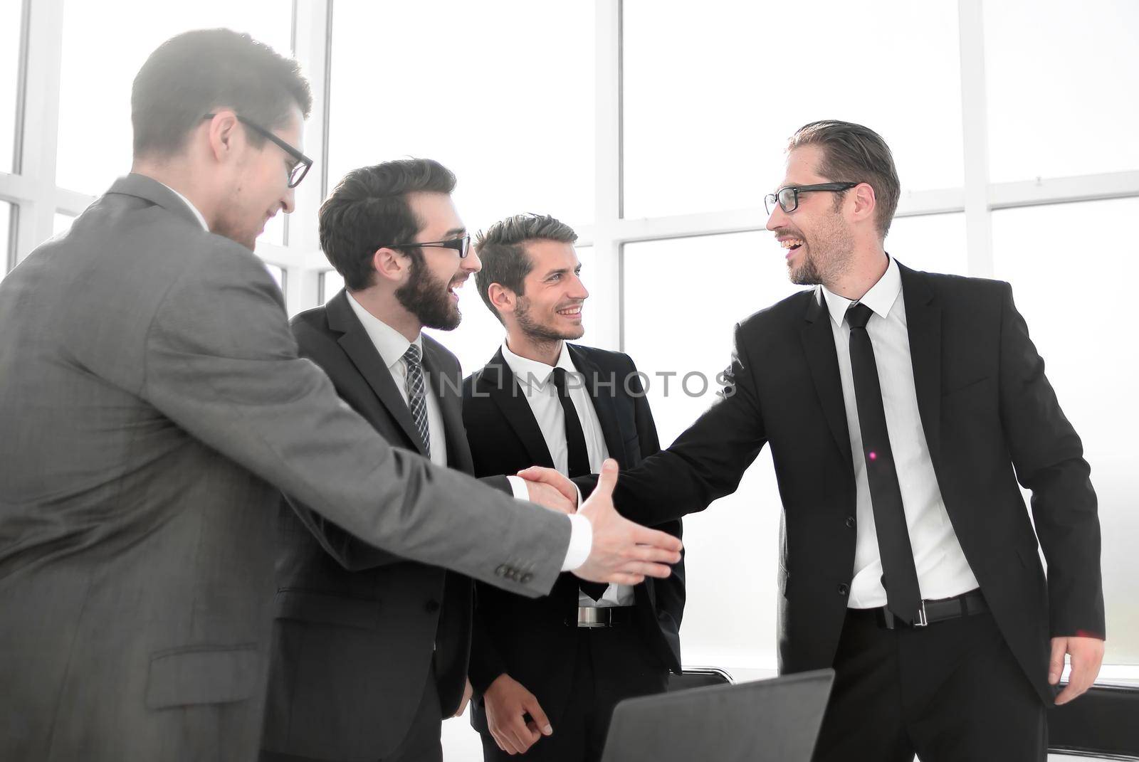 boss and employee shaking hands with each other by asdf